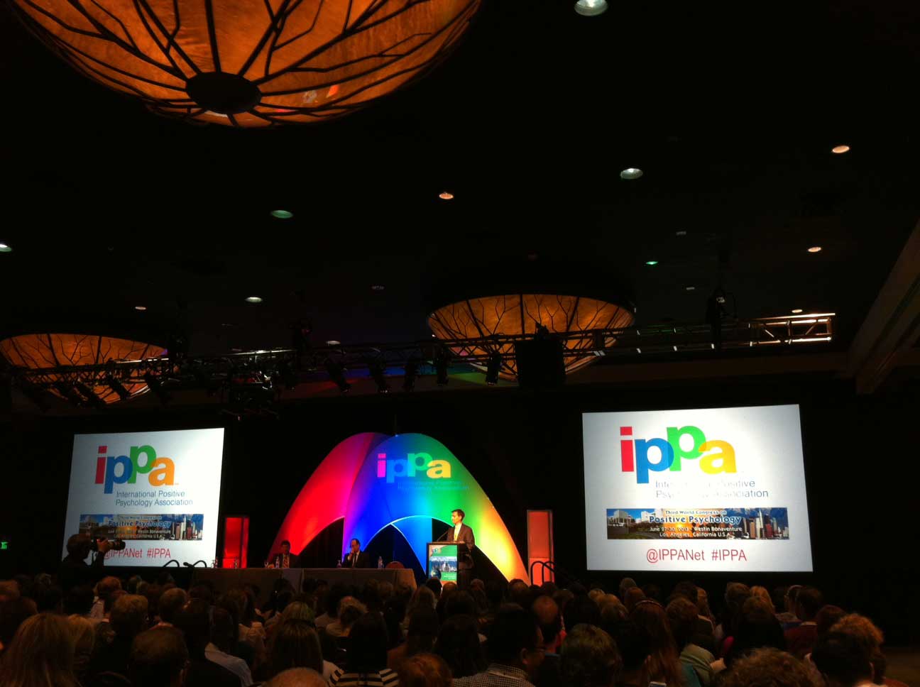 Dr. James Pawelski welcomes the crowd to the conference hosted by the International Positive Psychology Association