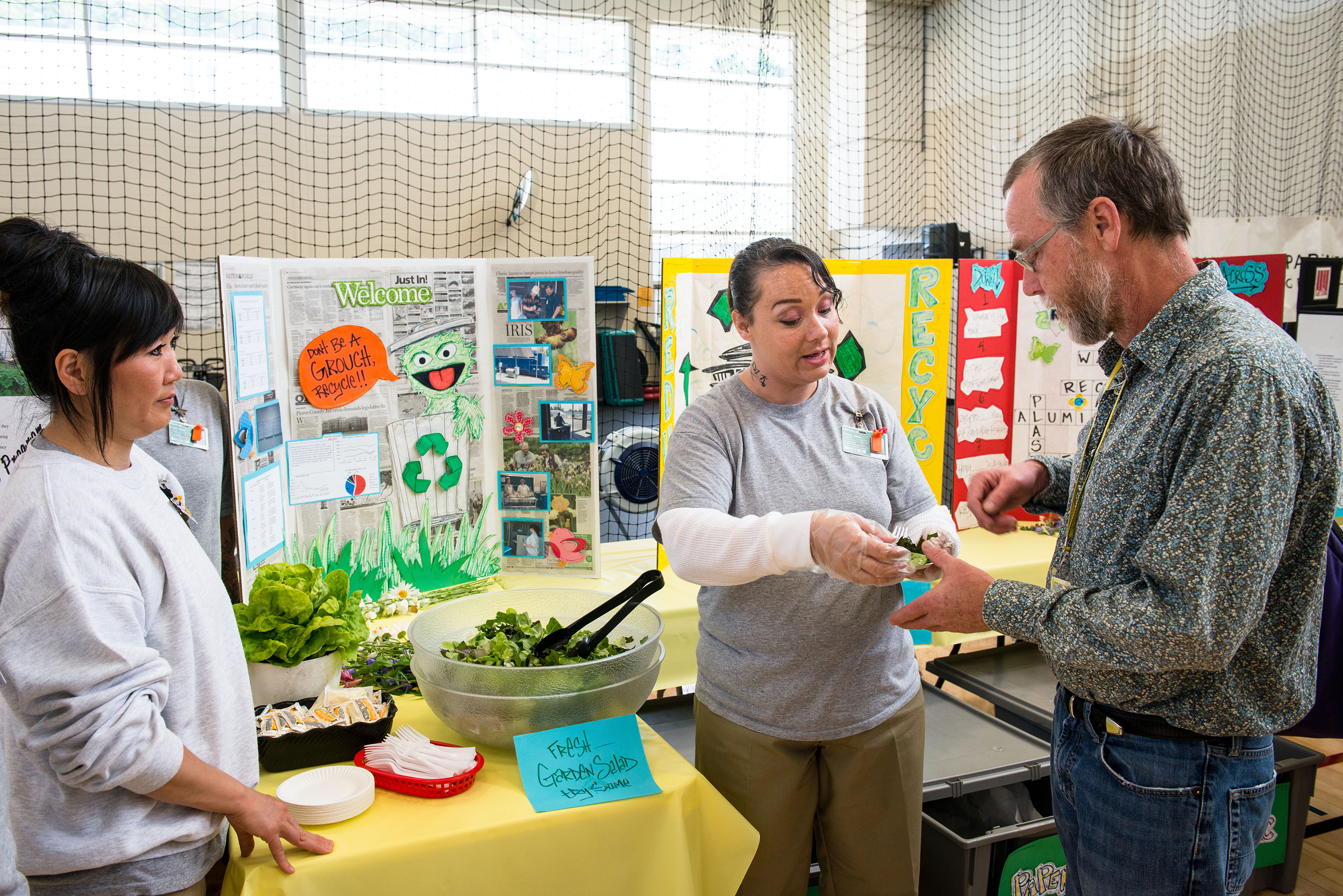 SPP's Carl Elliott receives prison-grown salad at the poster session