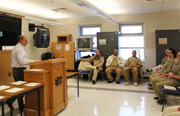 Superintendent of Stafford Creek Corrections Center (SCCC) speaks to the graduating class from two sessions of Roots of Success.