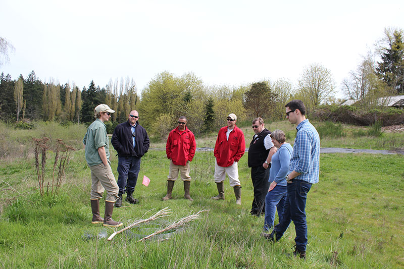 WDFW Biologist, Mr. Erwick, Jamar, Tim, Superintendent Cole, Mrs. Jorbin, and Anthony look at a turtle nest.
