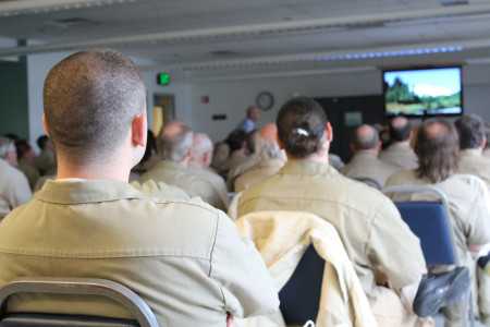 Students at Stafford Creek Corrections Center (SCCC) take in the lecture on Mt. Rainier.