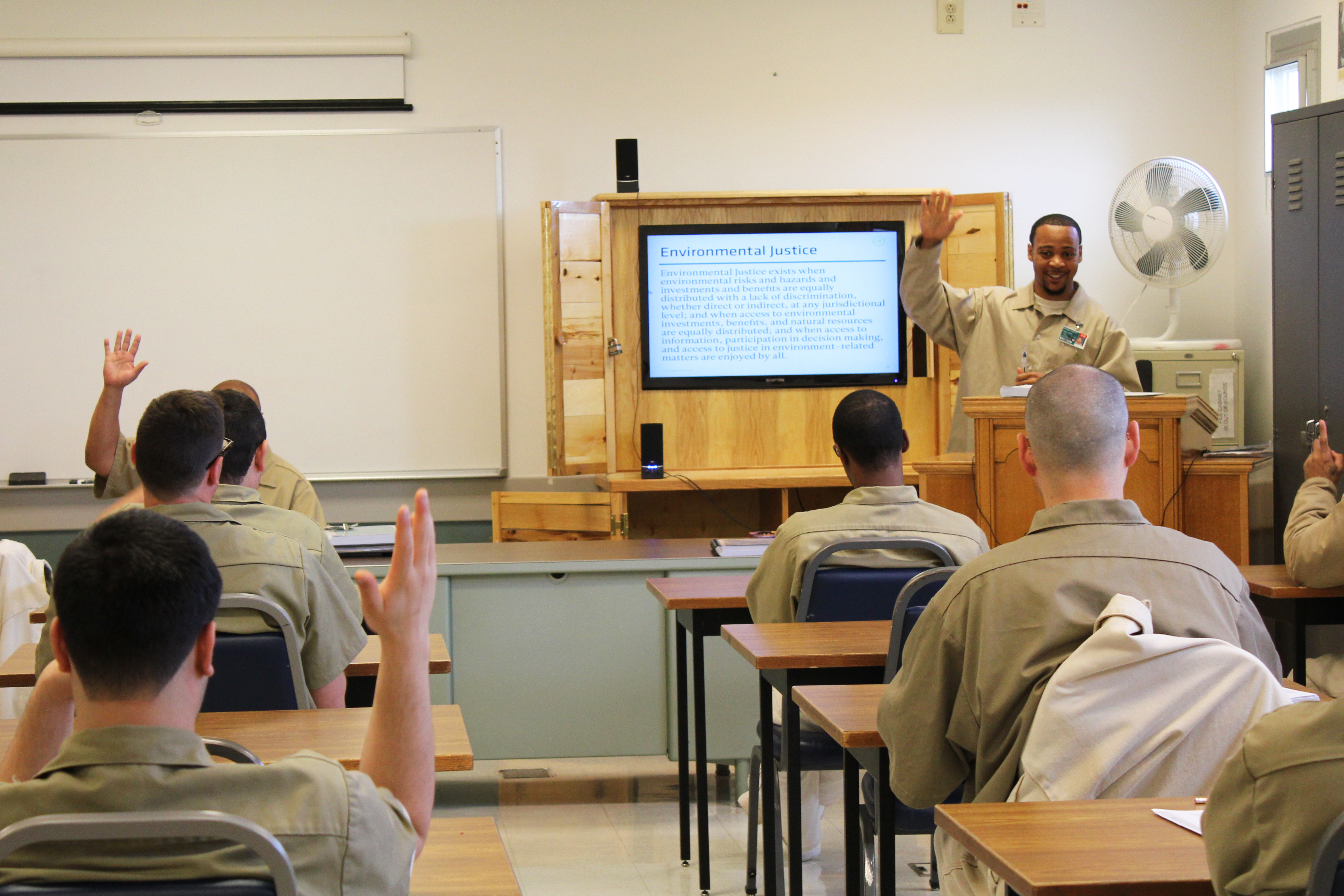Instructor Walrond leads discussion of exposure to pollutants and environmental toxins