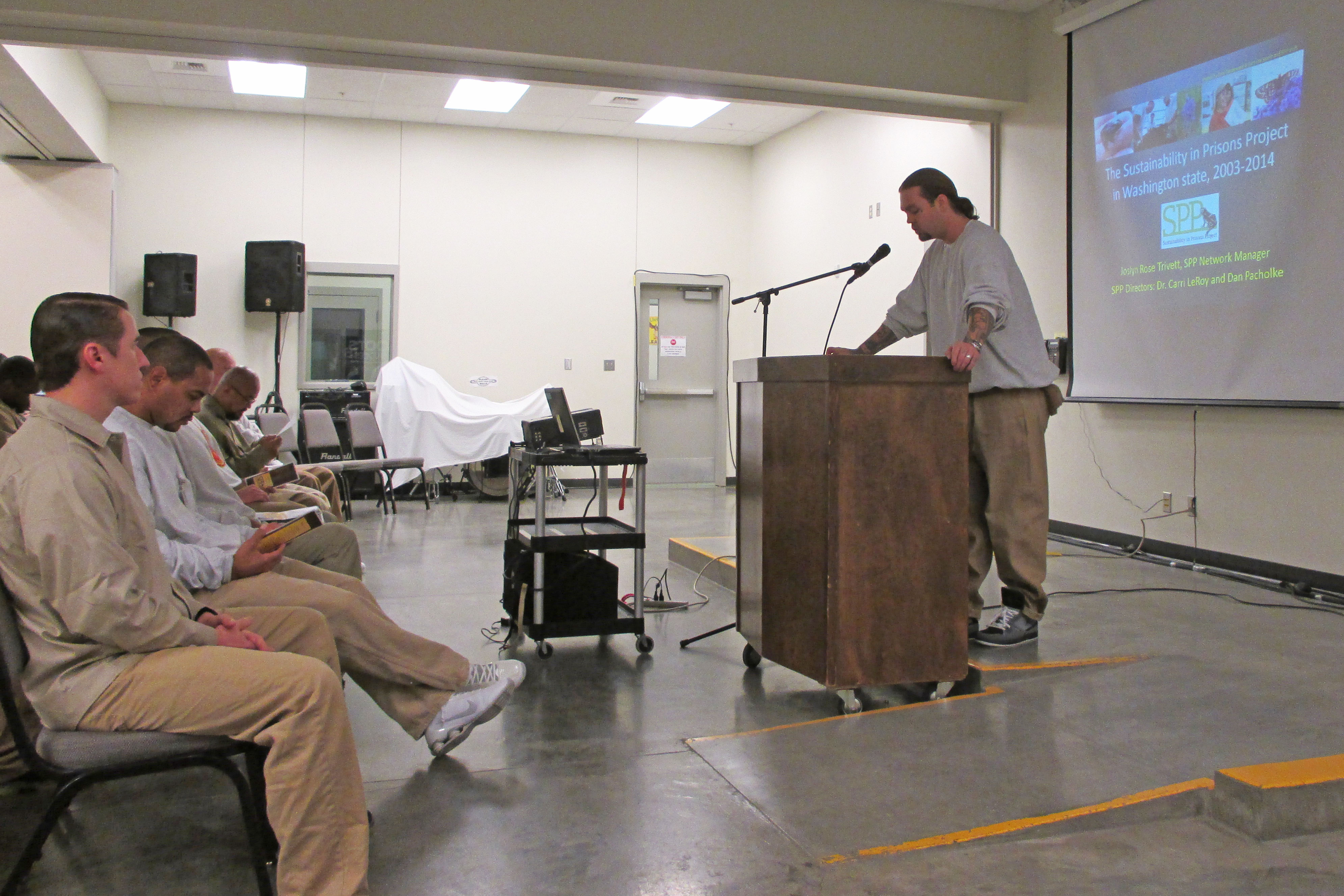 Roots of Success Instructor Jason McDaniels welcomes graduates and guests to the ceremony. Photo by Joslyn Rose Trivett