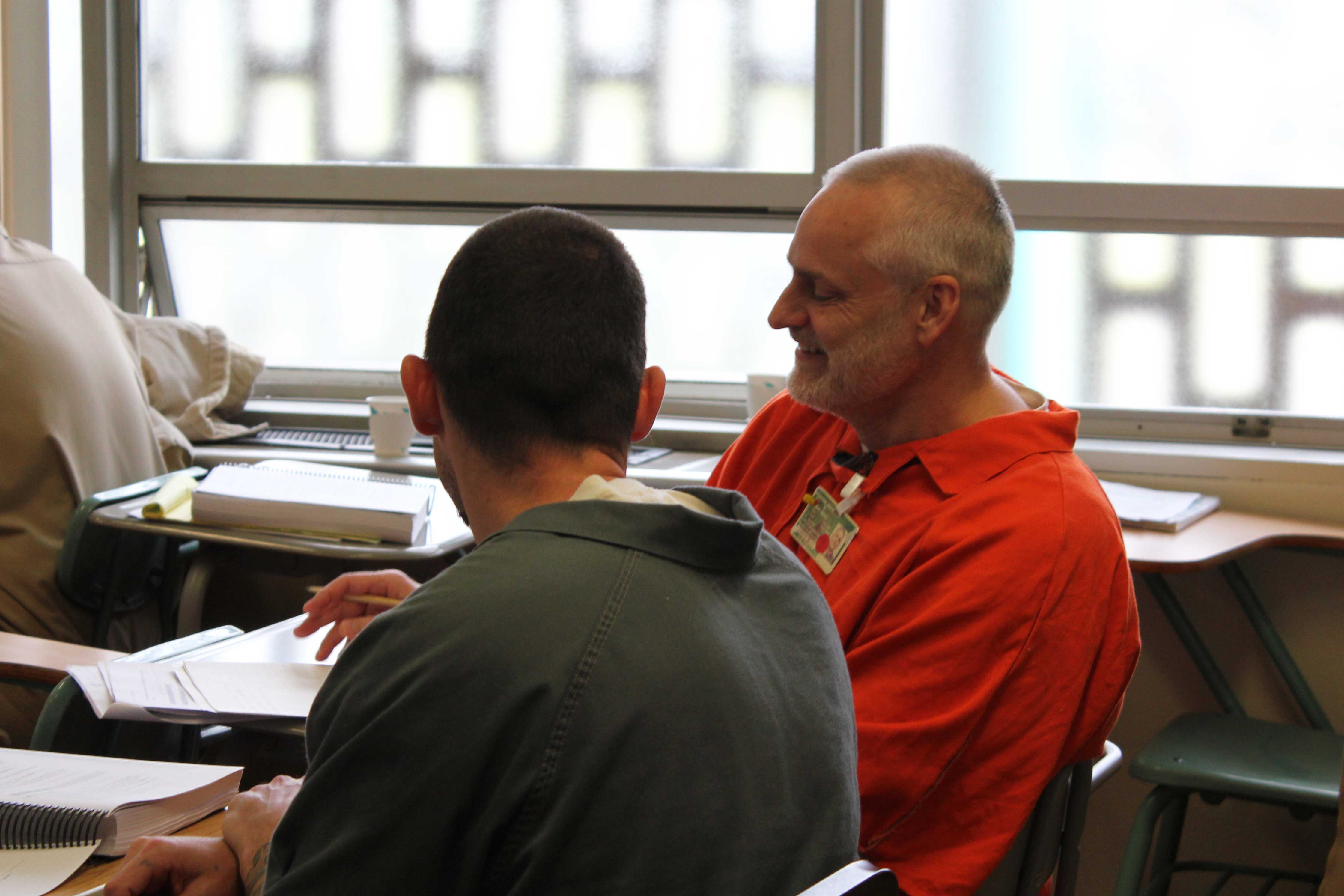 Kieth Parkins, Roots Master Trainer from WSP, works with a future Roots of Success instructor. Photo by Joslyn Rose Trivett.