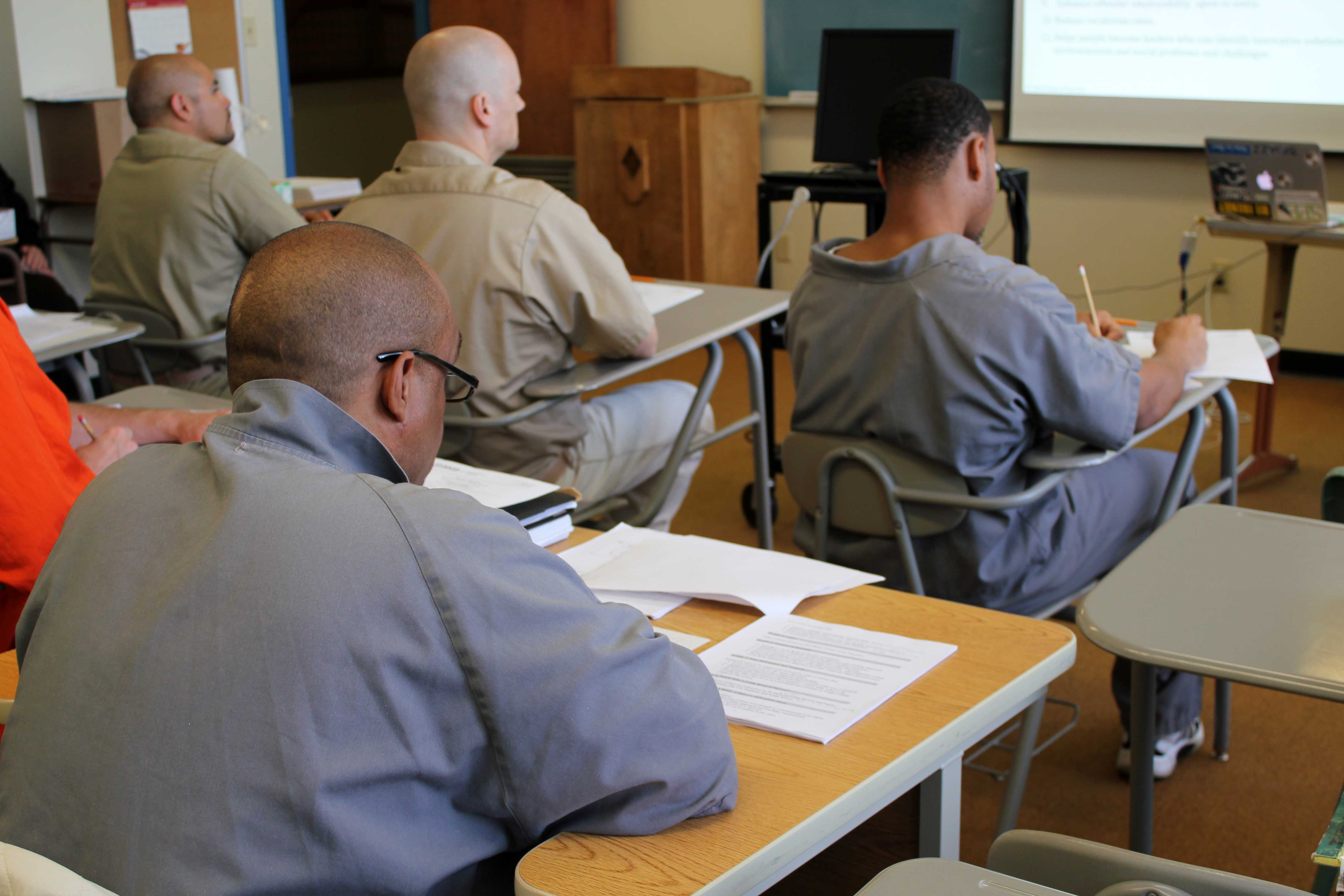 Master Trainers follow the day’s agenda with their training scripts as they take notes on Dr. Pinderhughes teaching techniques. Photo by Christina Stalnaker.