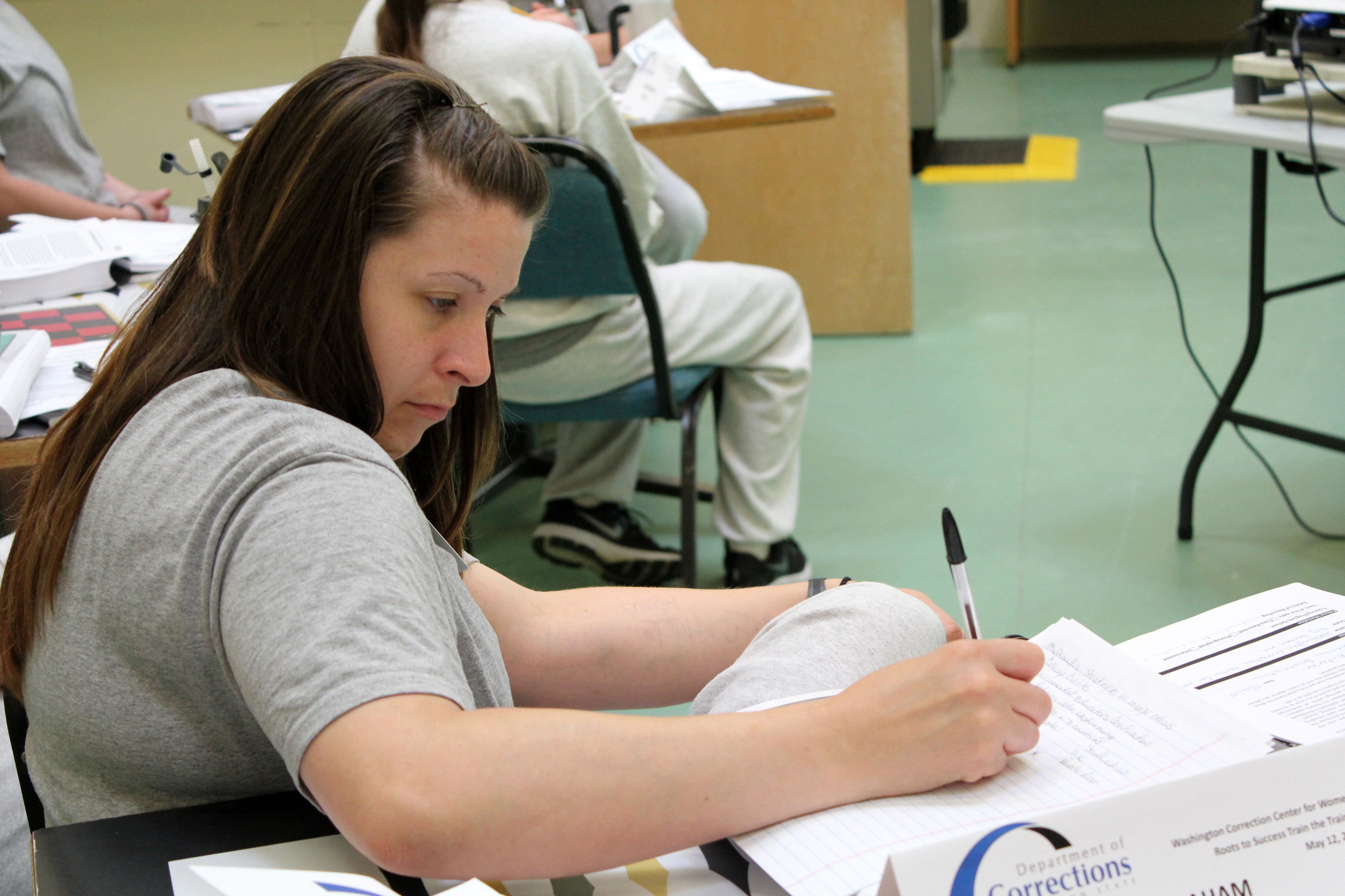 A future Roots of Success instructor takes careful notes.